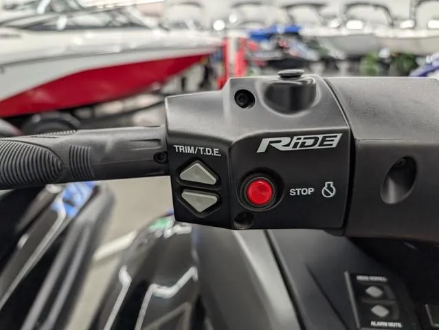 Slide: The Image of Handlebar controls of a 2020 Yamaha WaveRunner FX Limited SVHO, featuring trim and stop buttons. - 6