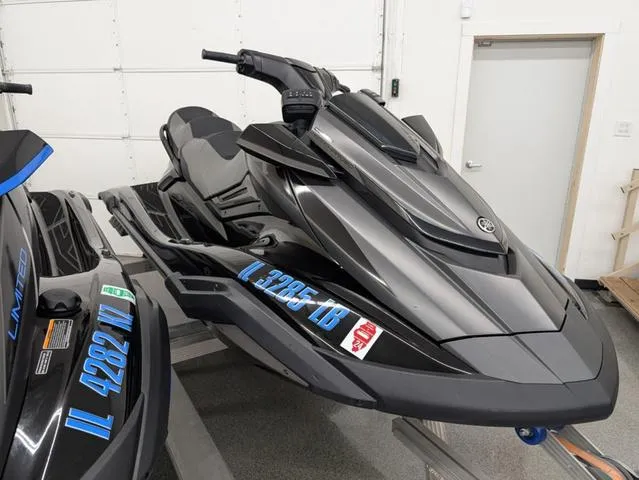 Slide: The Image of 2021 Yamaha WaveRunner FX Cruiser SVHO in a showroom, sleek black design. - 1