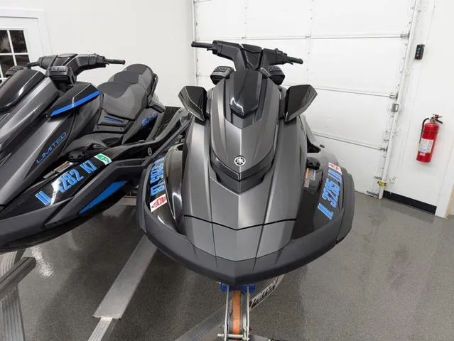 Slide: The Image of 2021 Yamaha WaveRunner FX Cruiser SVHO in a showroom, sleek design, gray and black color scheme. - 2