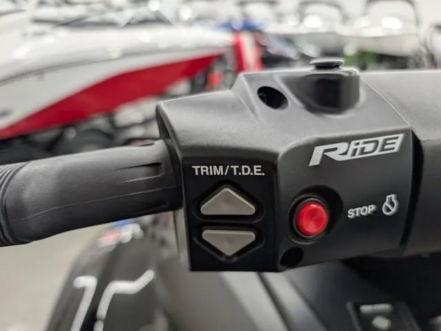 Slide: The Image of 2021 Yamaha WaveRunner FX Cruiser SVHO handlebar controls with trim and stop buttons. - 6