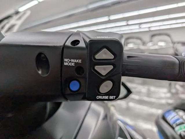 Slide: The Image of Close-up of 2021 Yamaha WaveRunner FX Cruiser SVHO handlebar controls, featuring no-wake mode and cruise set buttons. - 7