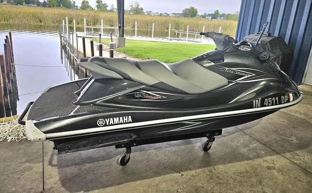 Slide: The Image of 2013 Yamaha WaveRunner VX jet ski in a garage near a dock. - 2