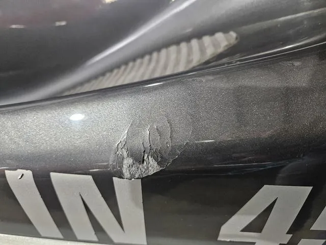 Slide: The Image of 2013 Yamaha WaveRunner VX with visible hull damage and registration number. - 5