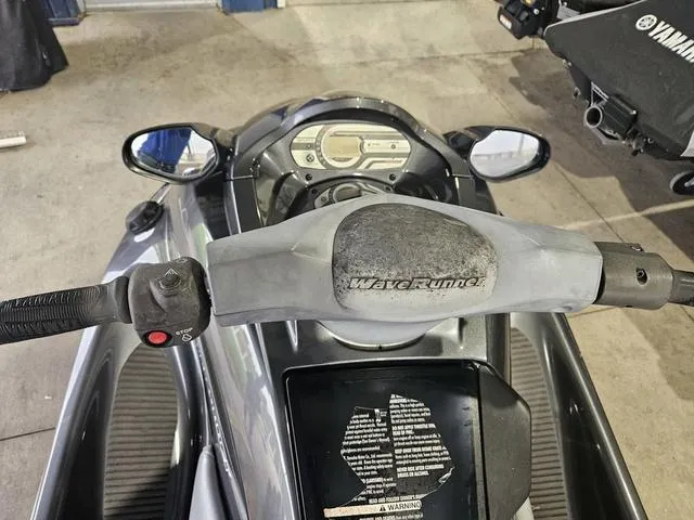 Slide: The Image of 2013 Yamaha WaveRunner VX dashboard and handlebars in a garage setting. - 6