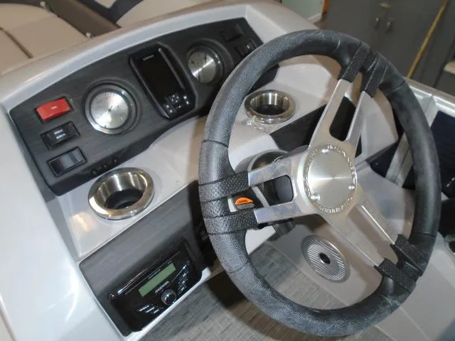 Slide: The Image of Steering console of 2023 Bennington 23 SXSR boat with gauges and controls. - 17