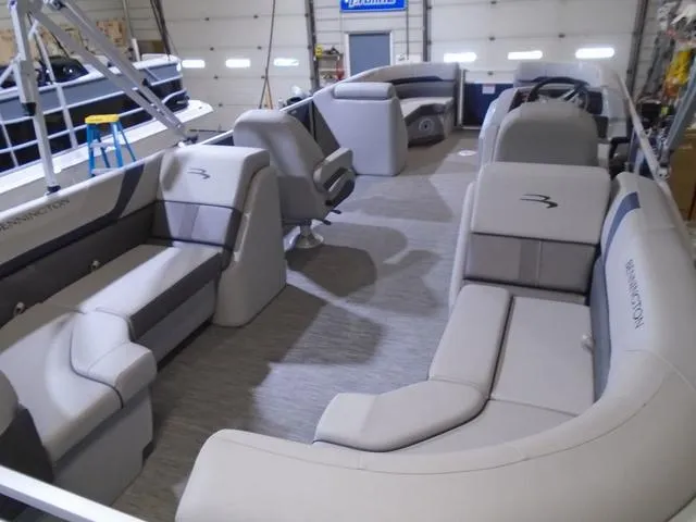 Slide: The Image of 2023 Bennington 23 SXSR pontoon boat interior with spacious seating and modern design. - 4