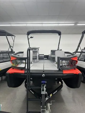 Slide: The Image of 2023 Sea-Doo Switch® Sport 21-230 hp pontoon boat in showroom, rear view. - 3