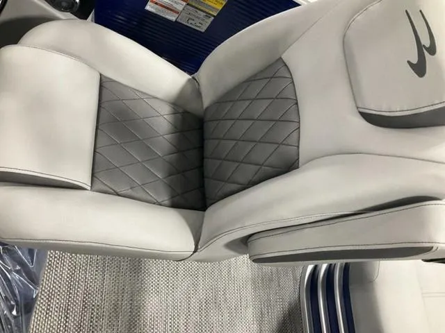 Slide: The Image of Luxurious seating on 2023 Bennington 23 LSB boat with quilted gray and white upholstery. - 14