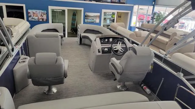 Slide: The Image of 2023 Bennington 23 LSB pontoon boat interior with modern seating and steering console. - 20