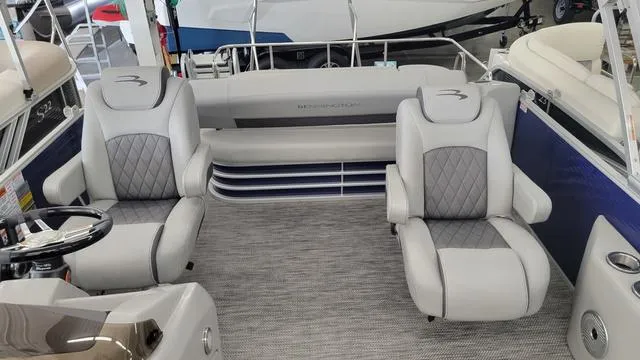 Slide: The Image of 2023 Bennington 23 LSB boat interior with plush gray seating and modern design. - 5