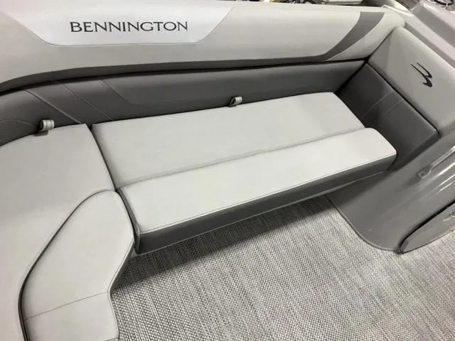 Slide: The Image of 2024 Bennington 21 SXL boat interior with sleek gray seating and modern design. - 12