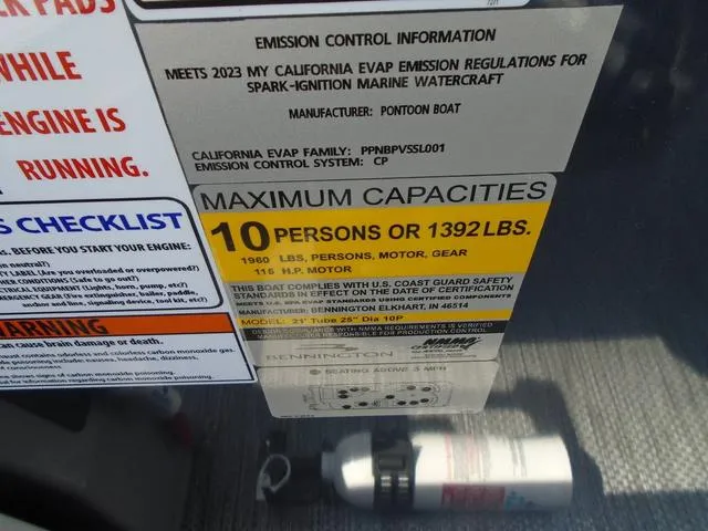 Slide: The Image of 2024 Bennington 21 SXL capacity label, max 10 persons or 1392 lbs, emission info. - 19