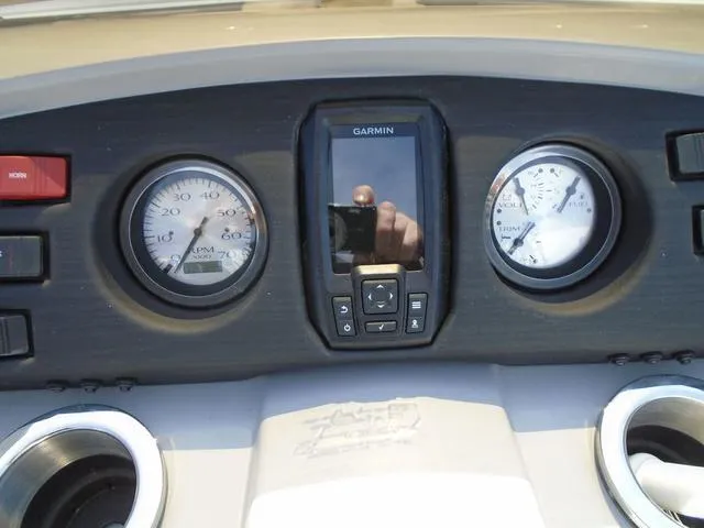Slide: The Image of Dashboard of 2024 Bennington 21 SXL with Garmin display and gauges. - 9