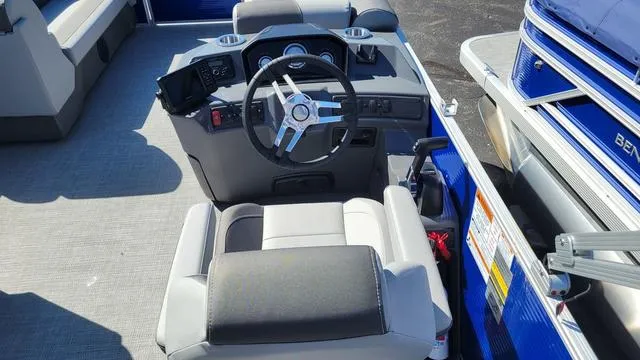 Slide: The Image of 2024 Bennington 20 SVL boat interior with steering wheel and seating. - 4