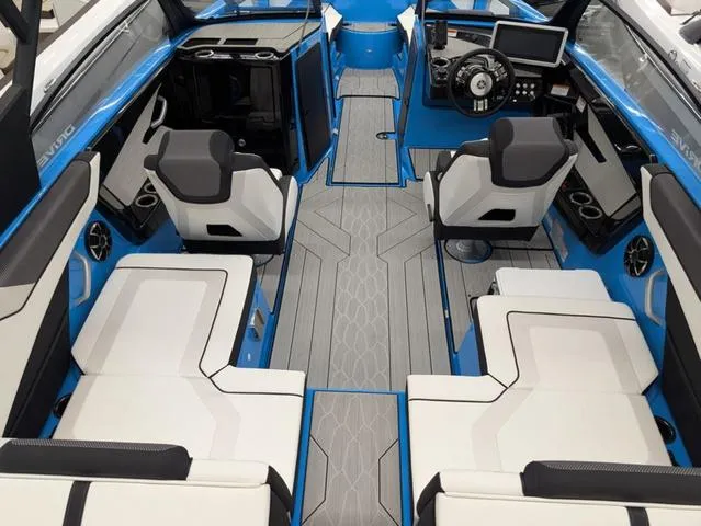 Slide: The Image of 2023 Yamaha Boats 222XD interior with modern seating, steering console, and blue accents. - 3