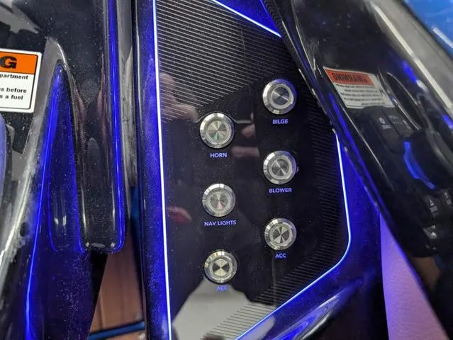 Slide: The Image of Control panel of 2024 Yamaha Boats 255XD with illuminated buttons for horn, bilge, blower, and lights. - 15