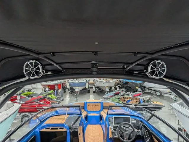 Slide: The Image of 2024 Yamaha Boats 255XD interior with speakers and dashboard, showcasing modern design and technology. - 5