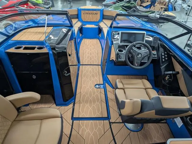 Slide: The Image of 2024 Yamaha Boats 255XD interior with modern dashboard and luxurious seating. - 6