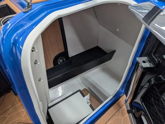 Slide: The Image of 2024 Yamaha Boats 255XD interior storage compartment with sleek design and modern features. - 7