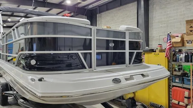 Slide: The Image of 2024 Hurricane FunDeck 2360 SBC OB boat in a workshop setting. - 10