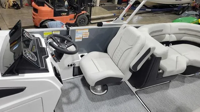 Slide: The Image of 2024 Hurricane FunDeck 2360 SBC OB boat interior with modern helm and seating. - 5