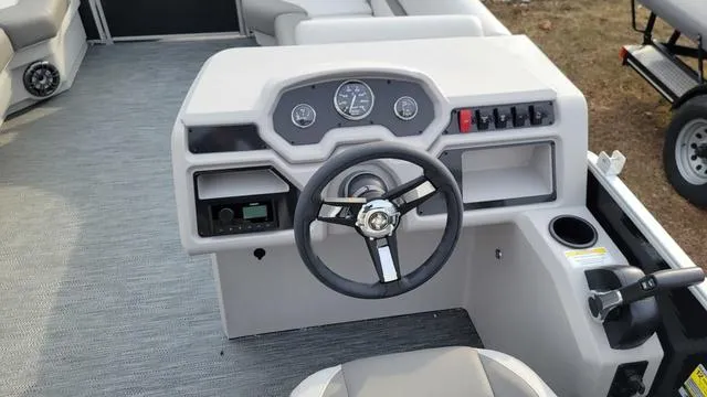 Slide: The Image of 2024 Godfrey Pontoons Xperience 2086 CX steering console with modern controls and gauges. - 3