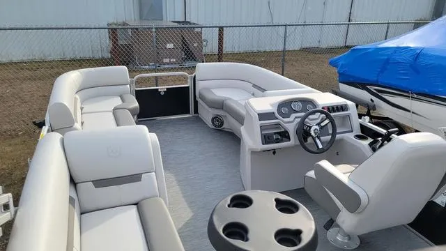 Slide: The Image of 2024 Godfrey Pontoons Xperience 2086 CX interior with spacious seating and modern helm. - 7