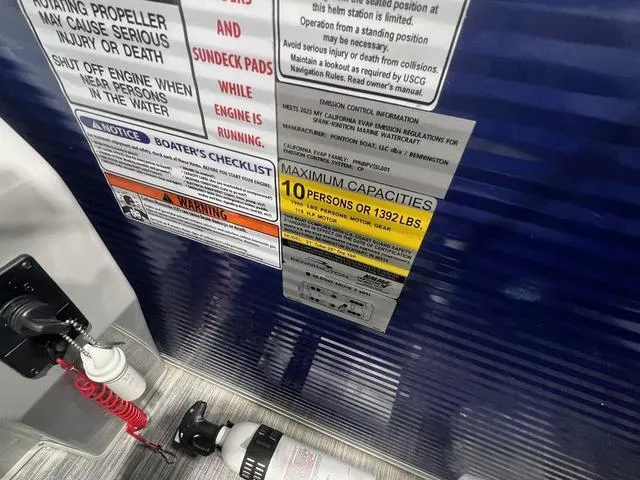 Slide: The Image of 2023 Bennington 22 SSR boat capacity and safety labels, showing a 10-person or 1392 lbs limit. - 14