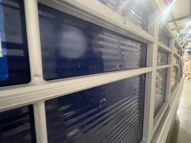 Slide: The Image of 2023 Bennington 22 SSR boat side panel with blue and white detailing. - 17