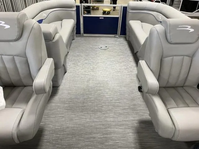 Slide: The Image of 2023 Bennington 22 SSR pontoon boat interior with gray seating and modern design. - 2