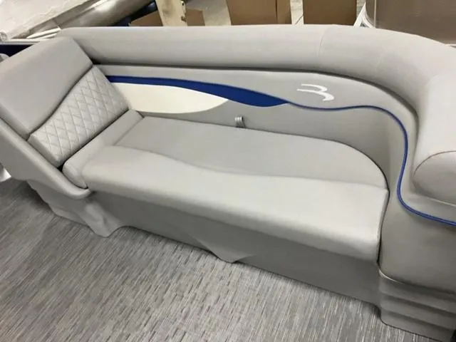 Slide: The Image of 2023 Bennington 22 SSR boat seat with gray upholstery and blue accents. - 5