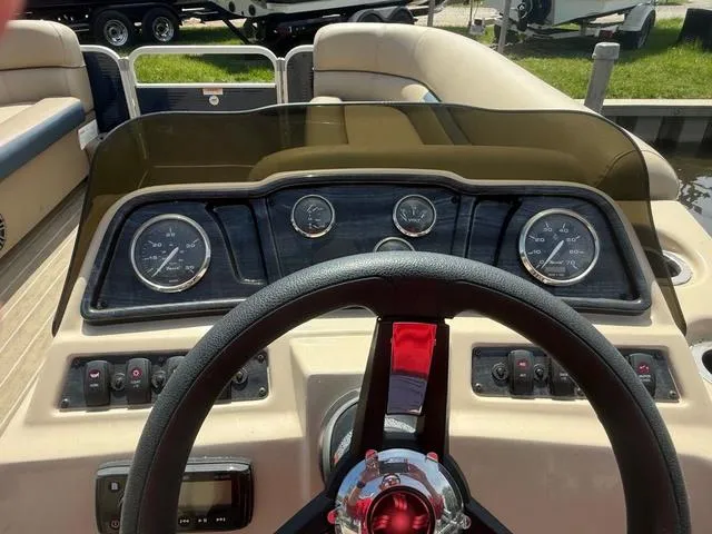 Slide: The Image of 2021 Godfrey Pontoons SW 2086 C dashboard with steering wheel and gauges. - 11