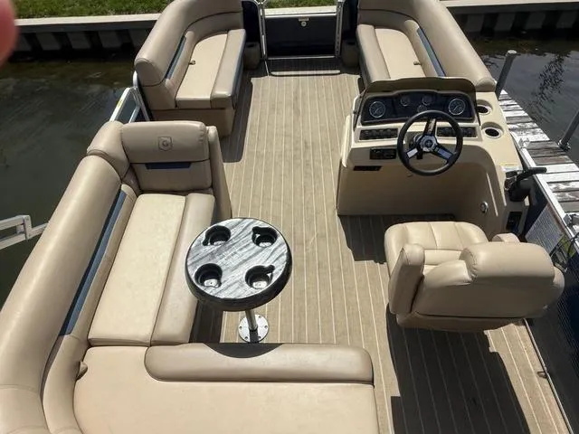 Slide: The Image of 2021 Godfrey Pontoons SW 2086 C interior with beige seating and steering console. - 4