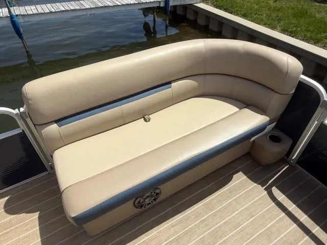 Slide: The Image of 2021 Godfrey Pontoons SW 2086 C boat seating, beige upholstery, docked by water. - 6