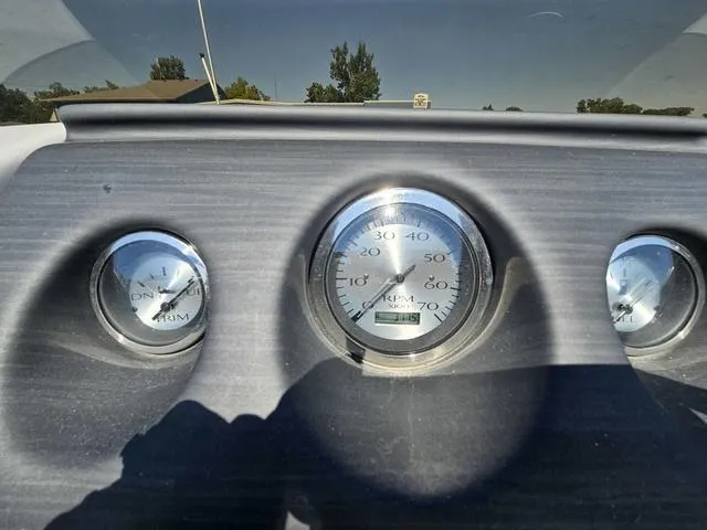Slide: The Image of Dashboard gauges of a 2023 Bennington 24 SSR boat under sunlight. - 6