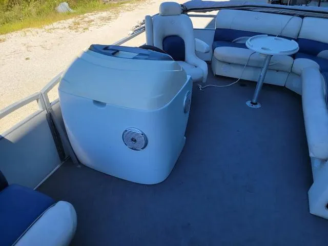 Slide: The Image of 2008 JC MFG Neptune 23 pontoon boat interior with seating and table. - 12
