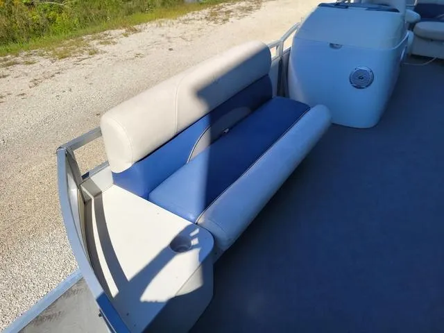Slide: The Image of 2008 JC MFG Neptune 23 boat interior with blue and white seating. - 6