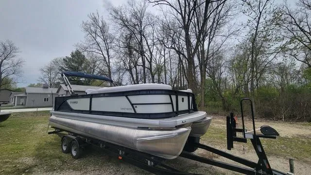 Slide: The Image of 2024 Godfrey Pontoons Sweetwater 2286 SFL on trailer, parked outdoors. - 12