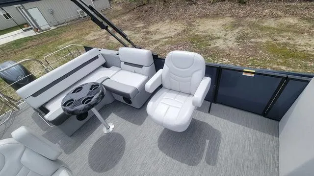 Slide: The Image of 2024 Godfrey Pontoons Sweetwater 2286 SFL interior with seating and table. - 4