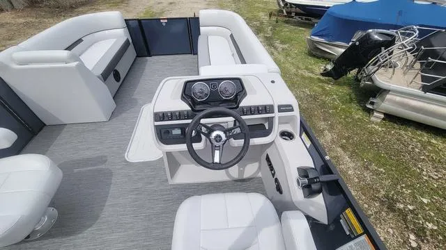 Slide: The Image of 2024 Godfrey Pontoons Sweetwater 2286 SFL interior with modern helm and seating. - 6