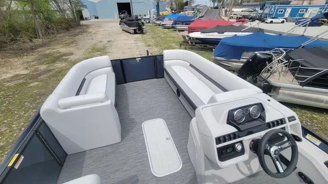 Slide: The Image of 2024 Godfrey Pontoons Sweetwater 2286 SFL, spacious interior with modern dashboard and seating. - 7