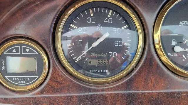 Slide: The Image of Dashboard of a 2000 Godfrey Pontoons San Pan, showing speedometer and fuel gauge. - 8