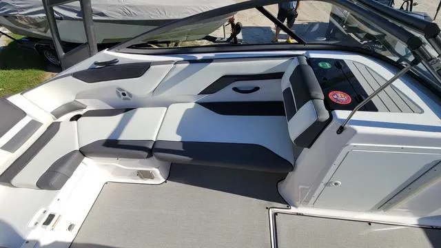 Slide: The Image of 2022 Yamaha Boats AR210 interior with sleek seating and modern design. - 10