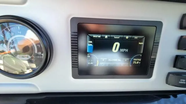 Slide: The Image of Dashboard of 2022 Yamaha AR210 boat showing speedometer and digital display. - 12