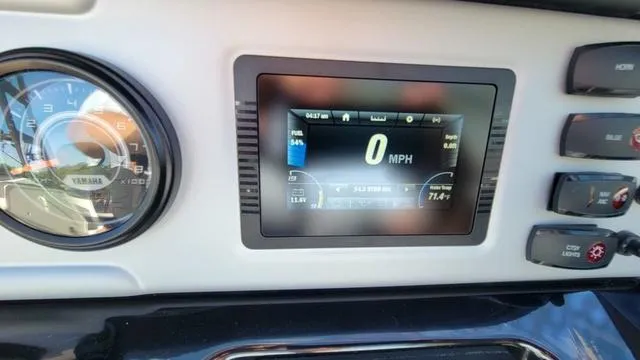 Slide: The Image of Dashboard of 2022 Yamaha Boats AR210 showing speedometer and control panel. - 13