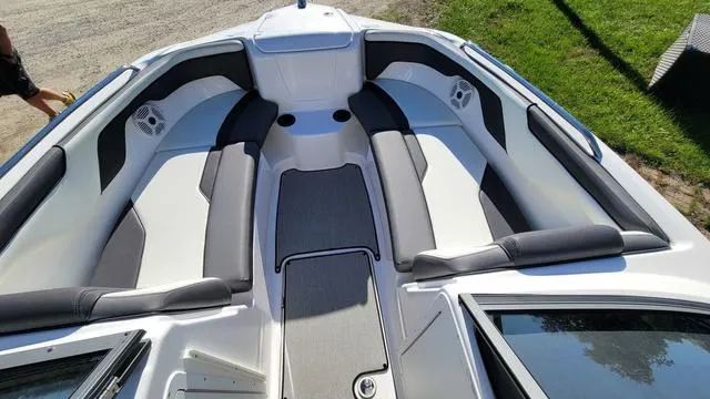 Slide: The Image of 2022 Yamaha AR210 boat interior with spacious seating and modern design. - 3
