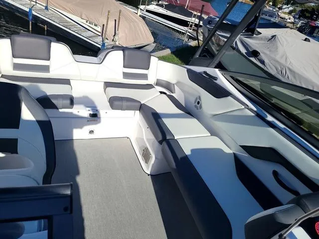 Slide: The Image of 2022 Yamaha AR210 boat interior with spacious seating and modern design. - 5