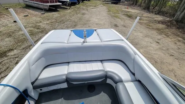 Slide: The Image of 2004 MasterCraft MariStar 210 boat interior with white seating and open-air view. - 3