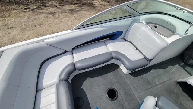 Slide: The Image of 2004 MasterCraft MariStar 210 boat interior with gray and white seating. - 4