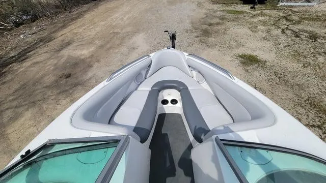 Slide: The Image of 2004 MasterCraft MariStar 210 boat interior with gray seating and cup holders. - 5